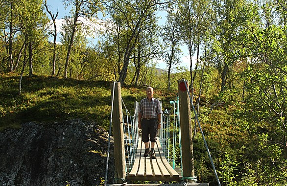 man crossing a bridge