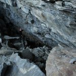 man standing in cave