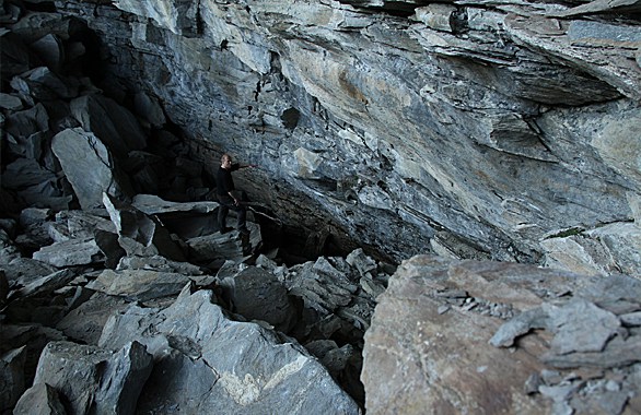 man standing in cave