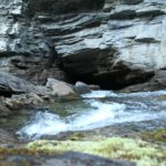 river going into cave