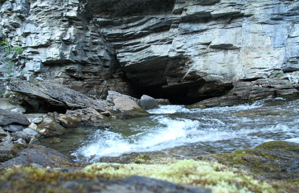 river going into cave
