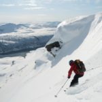 person skiing down mountain