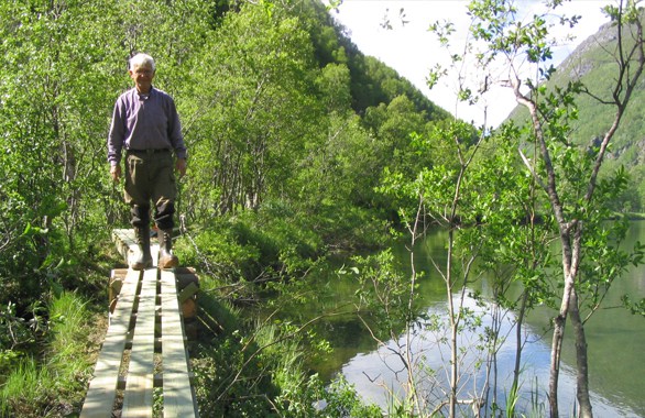 man crossing a bridge