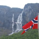 Norwegian flag with mountain in background