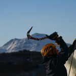 person ice climbing