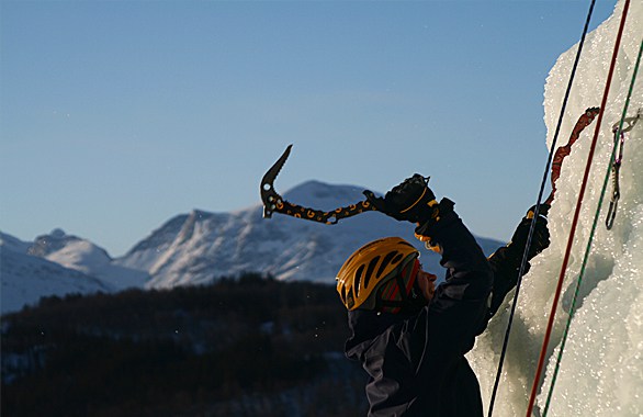 person ice climbing