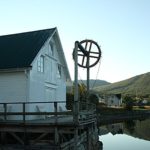 old wood house on a wood pier