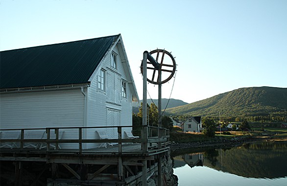 old wood house on a wood pier