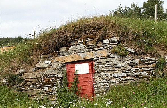 red door on a rock wall