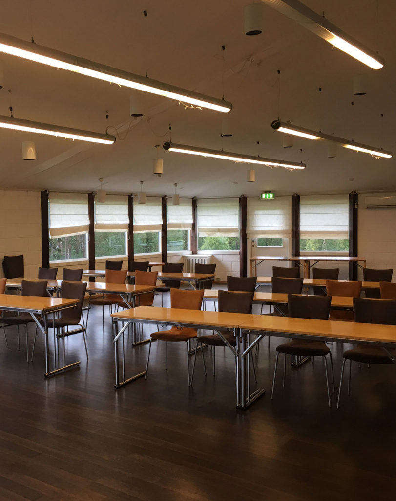 a large room with many chairs and table