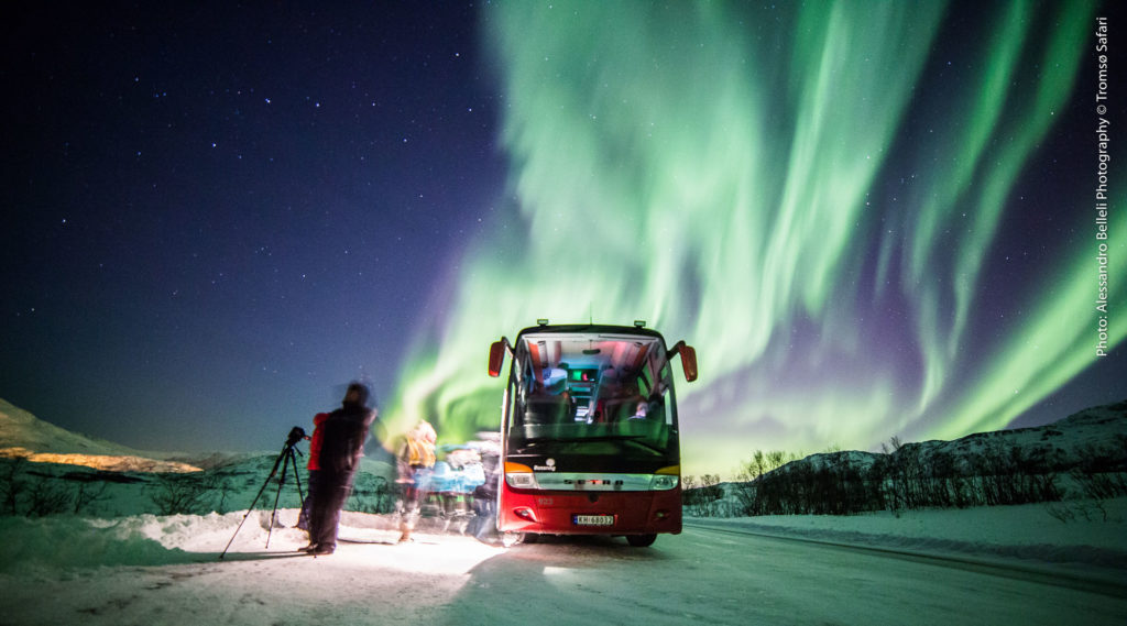 Photo. Arctic Route Bus under northern lights.